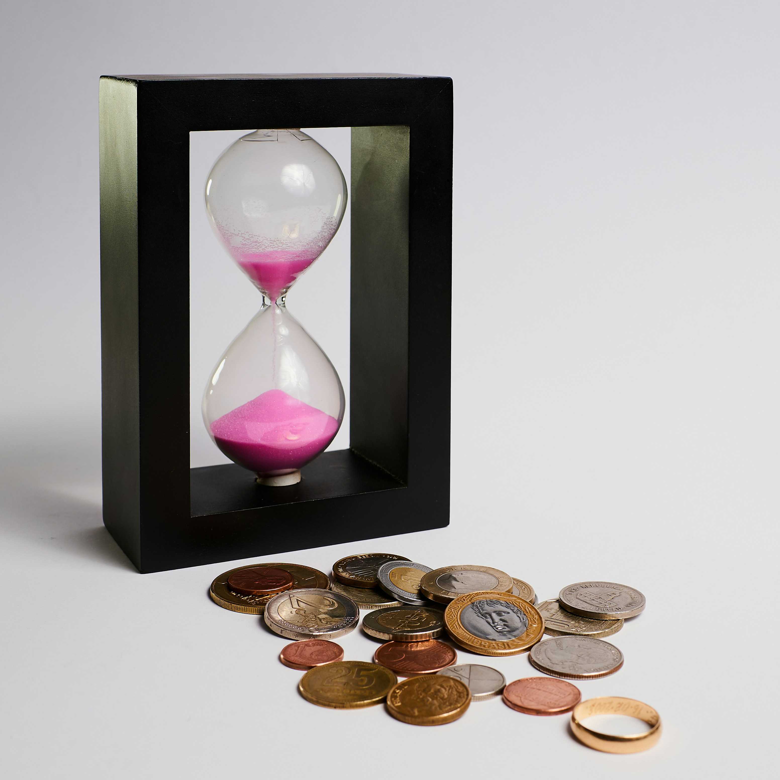 An image with a clock and money. It shows that time is money.